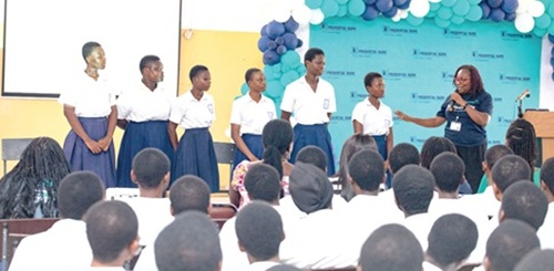 Jamila Disu (right), Total Quality Control Manager for Customer Care at Prudential Bank Limited, interacting with some final-year students of the school 
