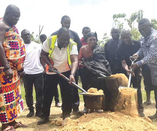 William Adzowu (2nd  from left), MCE for Obuase East, being assisted by Nana Amoakowaa III, to cut the sod for the commencement of a three-unit JHS block at Asonkore.  Pictures: EMMANUEL BAAH