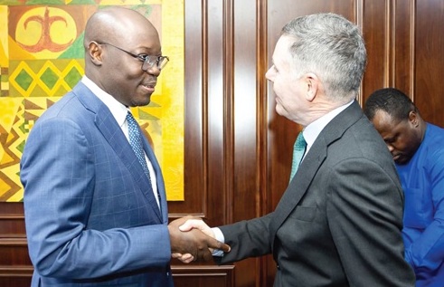 Dr Cassiel Ato Forson (left), Minister of Finance, exchanging pleasantries with Paschal Donohoe, Managing Director and Chief Knowledge Officer, World Bank, at the meeting
