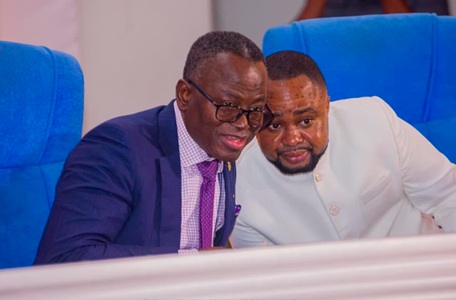 Justice Emmanuel Yonny Kulendi (left), a Justice of the Supreme Court, having a tete-tete with Wonder Victor Kutor, author of the book, at the launch 