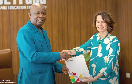 Paul Adjei (left), Administrator of GETFund, and Dr Emilia Zankina, Vice Provost for Global Engagement and Dean of Temple University, exchanging documents of the MoU