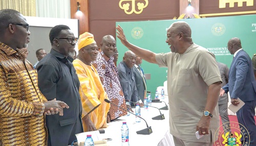President John Dramani Mahama (right) exchanging pleasantries with the leadership of Organised Labour during the dialogue