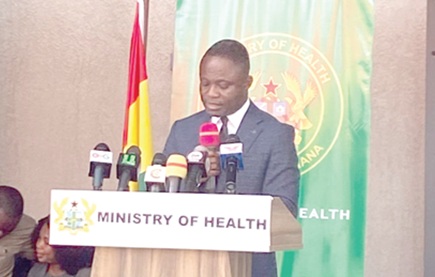 Kwabena Mintah Akandoh (left), Minister of Health, administering the oath to members of the board
