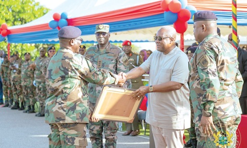 President John Mahama (2nd from right), presenting citations to members of the contingent. Looking on is Lieutenant General William Agyapong (right), Chief of the Defence Staff