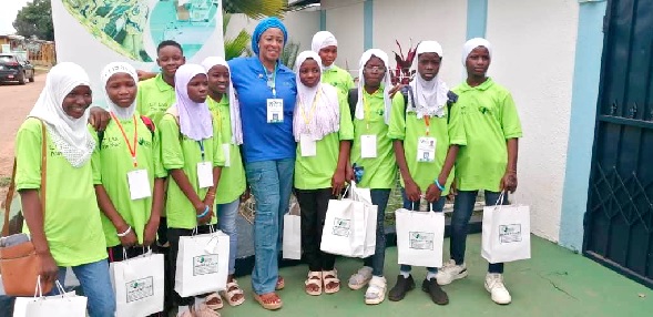 Hajia Memuna (arrowed) with some pupils after a free ICT training programme organised during their vacation.