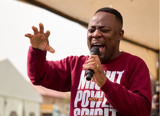 Nii Okai worships with Vine Christian High School