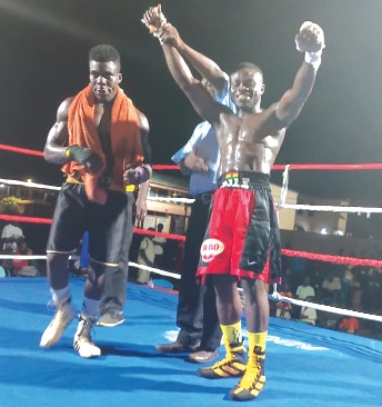John Zile celebratimg his stoppage win over Razak Nettey in Aflao