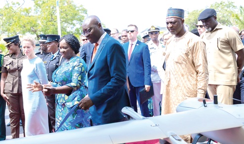 Prof. Naana Jane Opoku-Agyemang (2nd from right), Vice-President, explaining a point to Dr Cassiel Ato Forson (right), Minister of Finance, and Kaja Kallas (left), the High Representative and Vice-President of the European Union Commission, during an inspection of the equipment presented. With them are some government officials