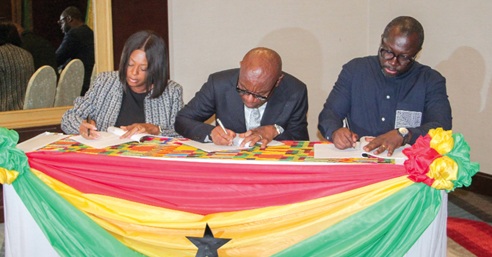 Kwasi Agyei (middle), Controller and Accountant General, John Awuah (right), CEO, Ghana Association of Banks, and Akosua Blay (left), Chief Business Officer, Ghana Interbank Payment and Settlement Systems Limited (GHIPSS), signing the agreement. Picture: ERNEST KODZI