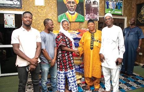 Gifty E. Appiah (3rd from left), Public Relations Officer, handing over the items to Alhaji Latif Abdul Salam, the Chief Protocol Officer. With them include Dr Yakubu Diomande (2nd from right), Export Manager, Latex Foam
