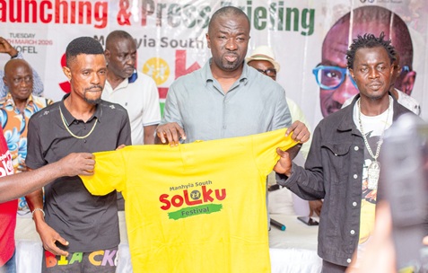 Nana Agyei Baffour Awuah (middle), MP for Manhyia South, with some constituents unveiling  a T-shirt for the Soloku festival at the launch