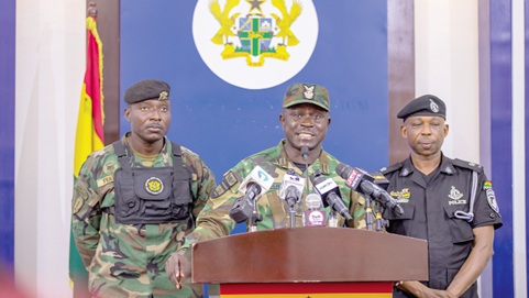 Col Dominic Buah (middle), the Director of Operations at NAIMOS, speaking during the engagement with the media