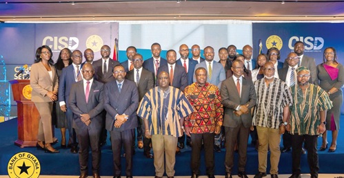 Julius Debrah (6th from left), the Chief of Staff, with Dr Johnson Pandit Asiama (5th from left), the Governor, BoG; Samuel Nartey George (6th from right), the Minister of Communication, Digital Technology and Innovations, and other dignitaries after the unveiling of the Cyber and Information Security Directive