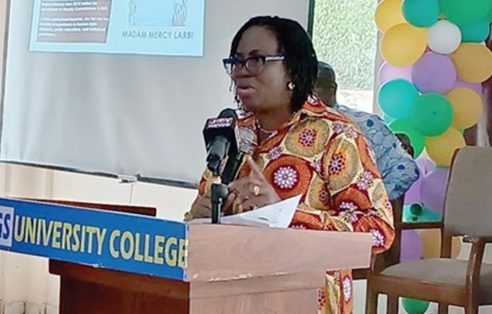 Mercy Larbi, Deputy CHRAJ Commissioner, speaking at the symposium