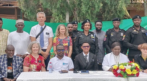 Dr Francis-Xavier Kojo Sosu (seated 2nd from right), Member of Parliament for the Madina Constituency, Adoboe Bright  Atawiah Kwami (4th from right), President of Freedom Aid Ghana, and others after the event