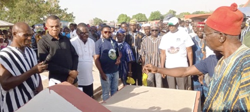 Stephen Aeke Akurugo (2nd from left), DCE for Kassena Nankana West, and Emmanuel Kuseh (left), Zenga Youth Association Chairman, together with other traditional leaders and stakeholders paying their last respect to the crocodile at its grave.