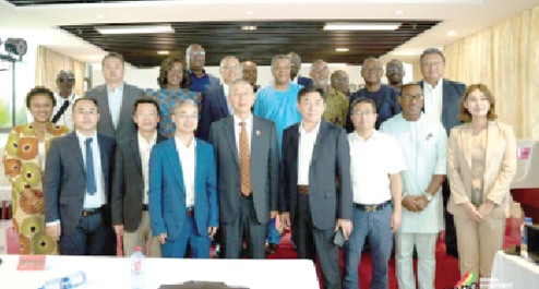 Some Chinese entrepreneurs and their Ghanaian counterparts after a business engagement in Accra recently
