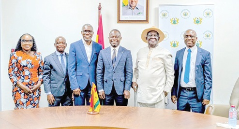 Dr Gameli Kewuribe Hoedoafia (3rd from left), Executive Secretary of the Inter-Ministerial Coordinating Committee on Decentralisation, with Kwabena Mintah Akandoh (3rd from right), Minister of Health, and Prof. Kwamena Ahwoi, Chairman of the Legislative Review Committee for IMCC, and other officials after the meeting