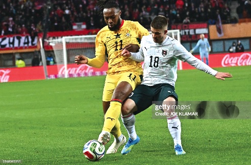 Ghana forward Antoine Semenyo (left) and Austria midfielder Romano Schmid battle for the ball during yesterday's encounter at the Ernst Happel Stadium in Vienna, Austria