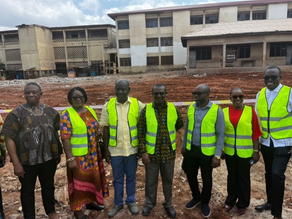 Emmanuel Kwasi Bedzrah(middle), Board Chairman of Ghana Education Trust Fund with other board executives at the site of the collapsed building.