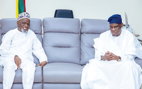Maulvi Mohammed Bin Salih (left), Ameer and Missionary-in-Charge of the Ahmadiyya Muslim Mission, in a discussion with Haruna Iddrisu, Minister of Education, during the courtesy call