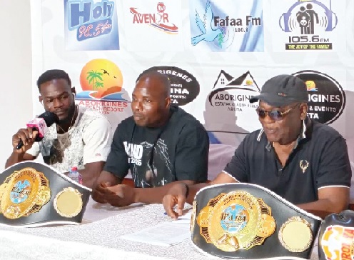 • Saviour Gad (right) and Eliasu Sulley trade words at the pre-fight press conference, flanked by Aborigines Boxing Promotions, CEO Mitch Gilbert Woollams (right)