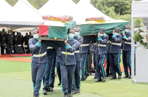 The remains of Capt. Frank Amoanyi Donkor and Elijah Ofori Donkor being carried by pallbearers after the burial service. Picture: ELVIS NII NOI DOWUONA 