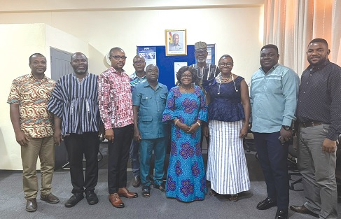 Christina Jatoe-Kaleo (3rd from right), the ECG Volta Regional General Manager, and other officials with staff of the Ho Nursing Training College