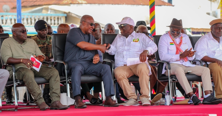 Joshua Ansah (3rd from right), Secretary-General, TUC, in a hearty handshake with President John Dramani Mahama at the May Day commemoration. Looking on are Julius Drebrah (left), Chief of Staff, and other dignitaries. Picture: ERNEST KODZI