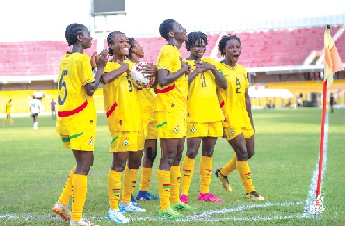 Players of the Black Princesses celebrating their equalising goal