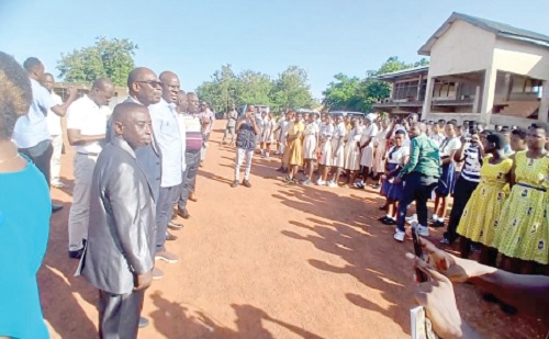 Haruna Iddrisu (arrowed), Education Minister, addressing the candidates, while Prof. Ernest Kofi Davis (2nd from left), Director-General of GES, and other officials look on 