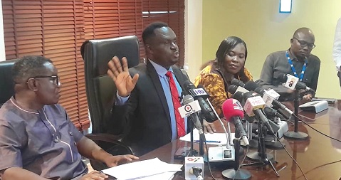 Eric Afful (2nd from left), Chairman of the Economy and Development Committee of Parliament, addressing the media. With him are members of the Majority Caucus
