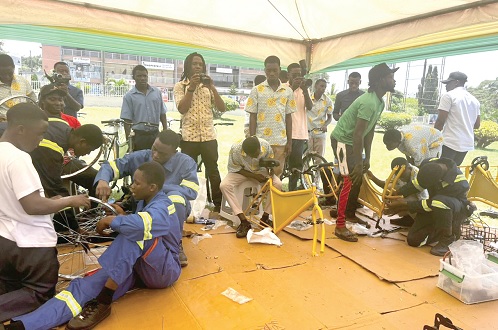 Some students assembling the bicycles at the event