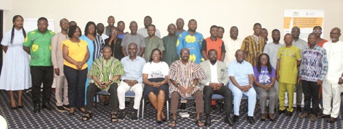 Dr Kennedy Brightson (seated 4th from right), Technical Advisor to the Vice-President on Health, Dr Peter Bedimak Yaro (seated 2nd from right), Executive Director of BasicNeeds-Ghana, and Dr Levena Gyimah (seated right), WHO Technical Officer for Mental Health, with other stakeholders after the meeting