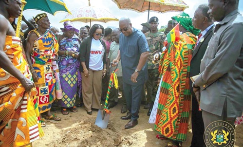 President John Dramani Mahama (with shovel)  performing a sod-cutting ceremony to officially start construction of the SDA College of Education at Asokore