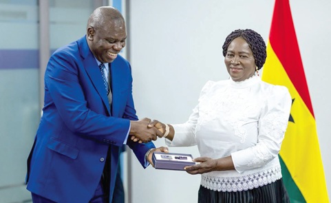 Michael Harry Yamson (left), Administrator of the DACF, presenting a gift to Professor Naana Jane Opoku-Agyemang, Vice-President