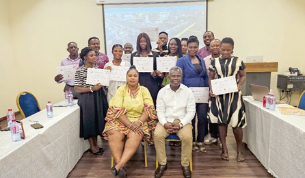 Emmanuel Treku (seated right) and Rebecca Ekpe, the facilitators, with participants after the training