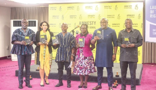 Francis Nyantakyi (3rd from left), Board Chairman of Amnesty lnternational Ghana, with Hannah Osei (3rd from right), Director of Amnesty lnternational Ghana; Anthony Mmieh (2nd from right), MP for Odotobri, and other officials declaring the Human Rights report launched. Picture: CALEB VANDERPUYE