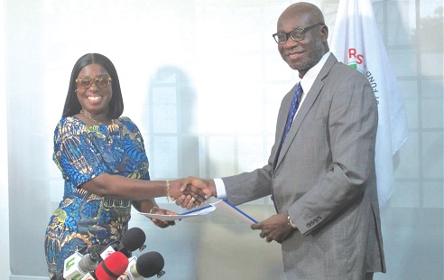 Obuobia Darko- Opoku (left), Administrator of the Ghana Medical Trust Fund, and Prof. Richard M. K. Adanu, Rector of the Ghana College of Physicians and Surgeons, exchanging the signed documents. Picture: ESTHER ADJORKOR ADJEI 