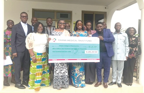 Obuobia Darko- Opoku (4th from right), Administrator of GMTF, and Yvonne Yirenkyiwaa Esseku (4th from left), Rector of the Ghana College of Pharmacists,  after signing the MoU. Picture: ESTHER ADJORKOR ADJEI 