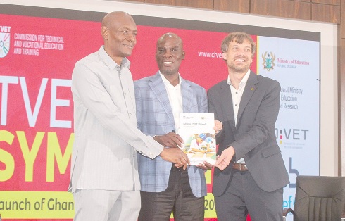 Haruna Iddrisu (middle), Minister of Education, with Daniel Bōhme (right), Head, Development Cooperation, German Embassy, and Zakaria Sulemana (left) Director-General, TVET, jointly displaying the report after the launch. Picture: ERNEST KODZI