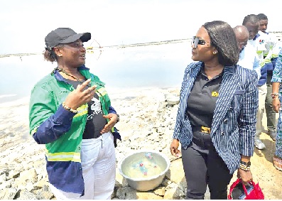 •Mrs Nelson interacting with a female worker at Electrochem during her official tour of the company's salt production site