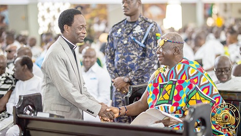 Otumfuo Osei Tutu II being congratulated by Apostle Prof.  Opoku Onyinah, a former Chairman of the Church of Pentecost