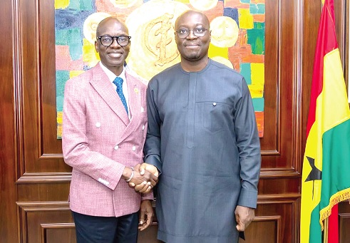 Dr Cassiel Ato Forson (right), Minister of Finance, exchanging pleasantries with Dr Mohamed Yakub Janabi, World Health Organisation’s Regional Director for Africa, after the meeting