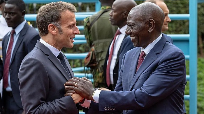 The French president (L) is in Kenya, where he is co-hosting the Africa Forward Summit alongside his Kenyan counterpart (R)