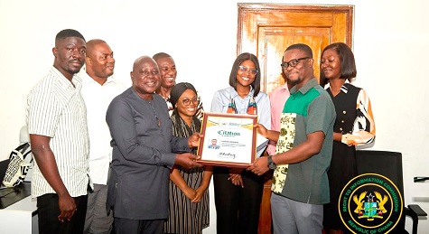 Louis Opoku (right) receiving his award from Kweku Sersah-Johnson, Technical Advisor, RTIC