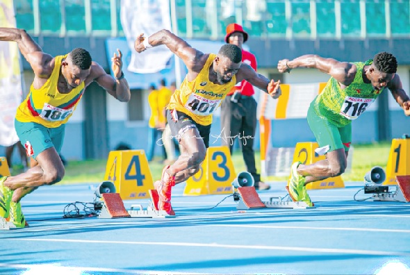• Ghanaian sprinter Joseph Paul Amoah (middle) gets out of the blocks during his 100 metres heats yesterday at the Univerity of Ghana Stadium