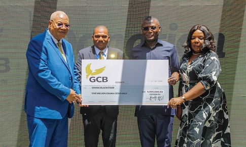 Prof. Joshua Alabi (left), Board Chairman, GCB Bank PLC, presenting the dummy cheque to Kofi Iddie Adams (2nd from right), Minister of Sports and Recreation. With them are Farihan Alhassan, Managing Director, GCB Bank PLC, and Wilhelmina Asamoah, Chief Director, Ministry of Sports and Recreation. Picture: ELVIS NII NOI DOWUONA 