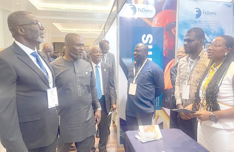 FROM LEFT TO RIGHT: Kwabena Bempong, Kenneth Gilbert Adjei, Seth Emmanuel Terkper, and other dignitaries touring the exhibition stands mounted by partners and sponsors