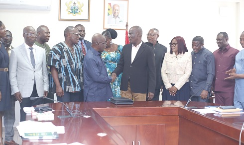 Prof. Kweku Danso Boafo (3rd from left), Council Chairman, UEAS, being congratulated by Haruna Iddrisu (6th from right), Education Minister. With them are council members of the university. Picture: BENEDICT OBUOBI